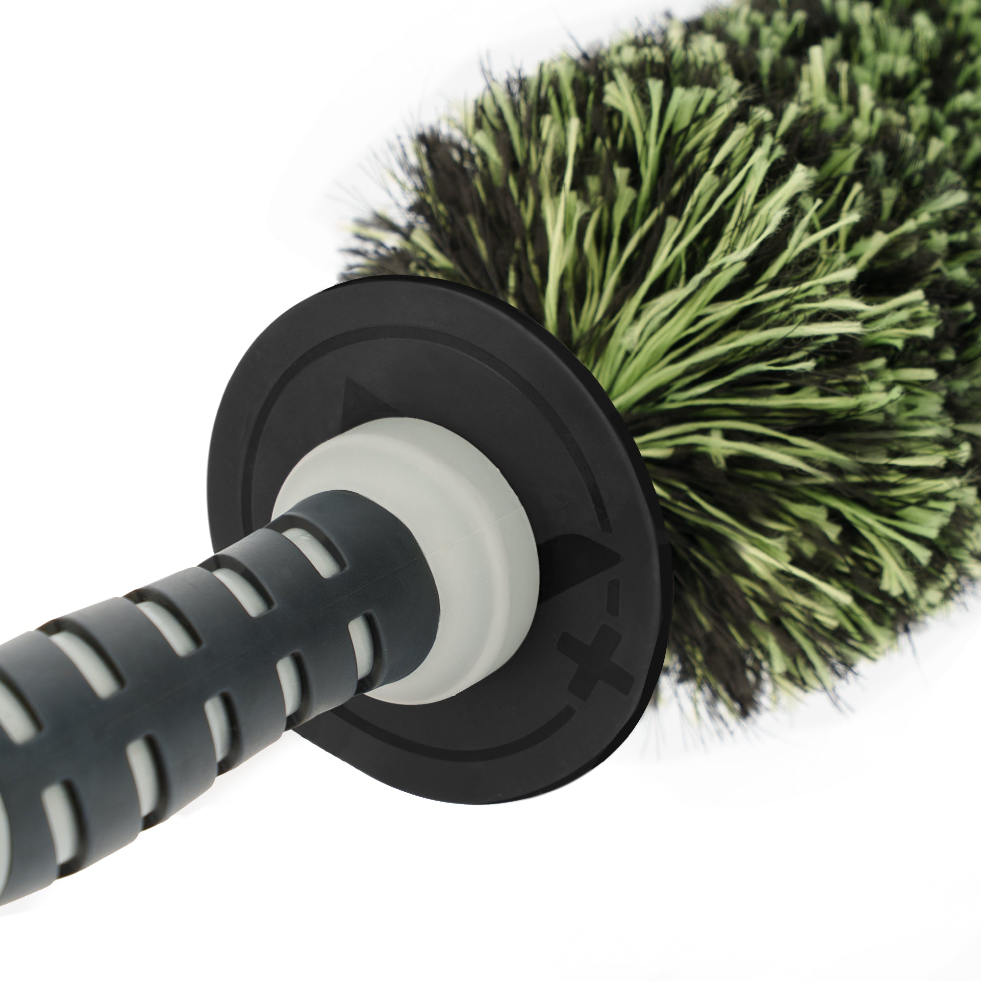 Wheel barrel cleaning brush with green bristles on a white background