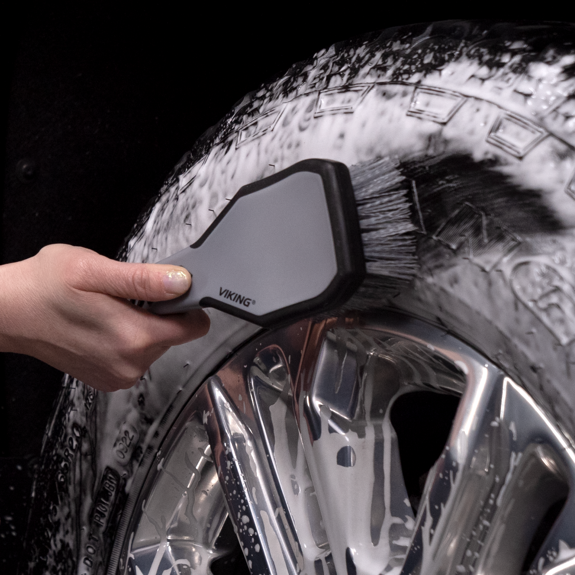 tire brush scrubbing tire wall