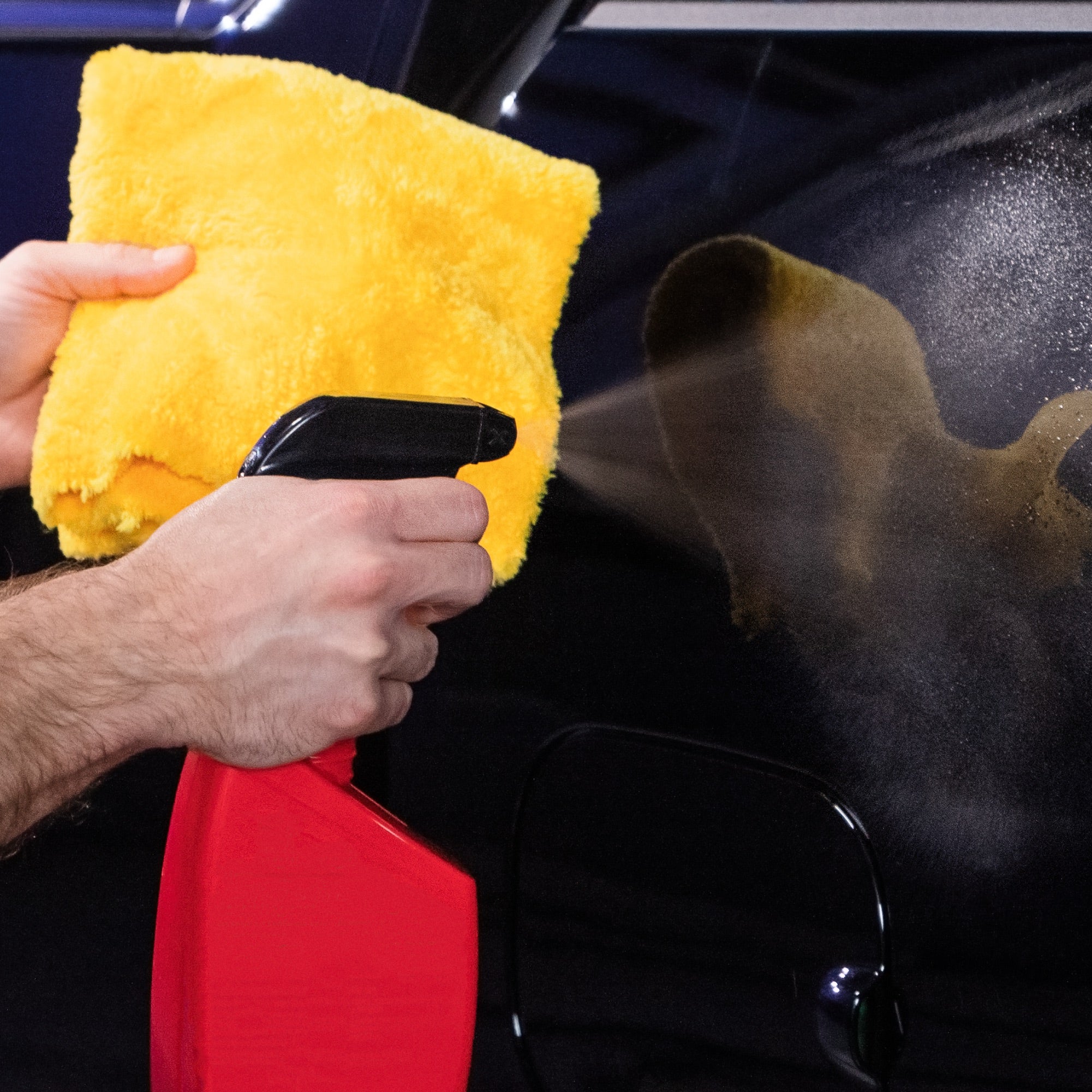 ultra plush finishing towel about to clean with vehicle cleaning spray