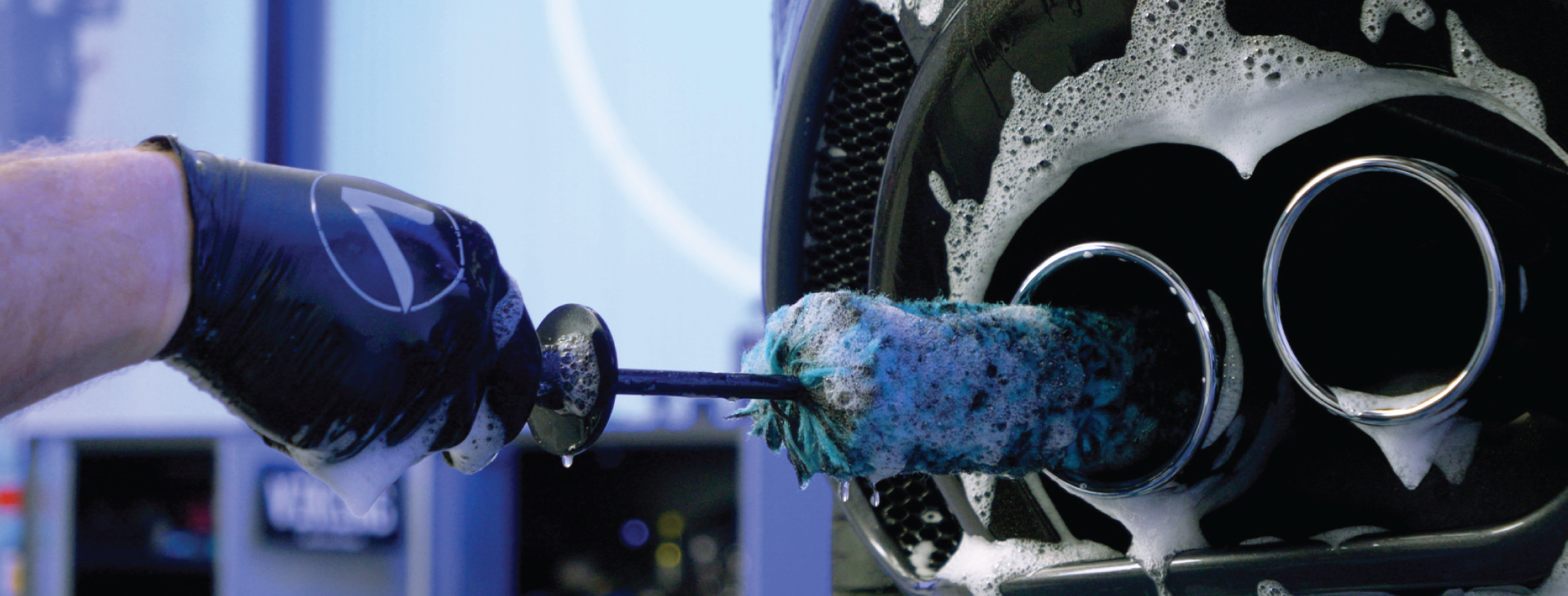 wheel barrel brush cleaning a tailpipe