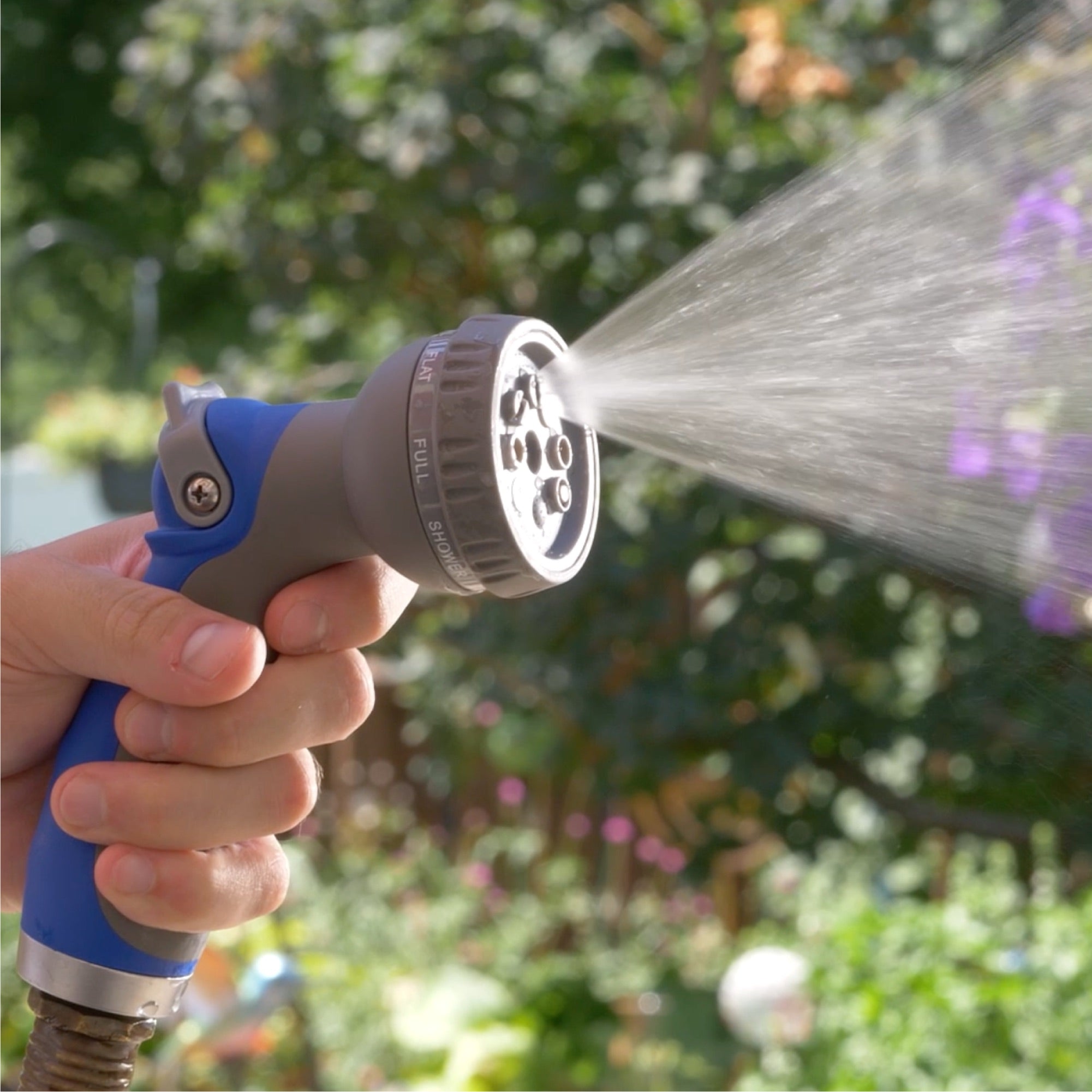 thumb control 8 way spray nozzle spraying in garden